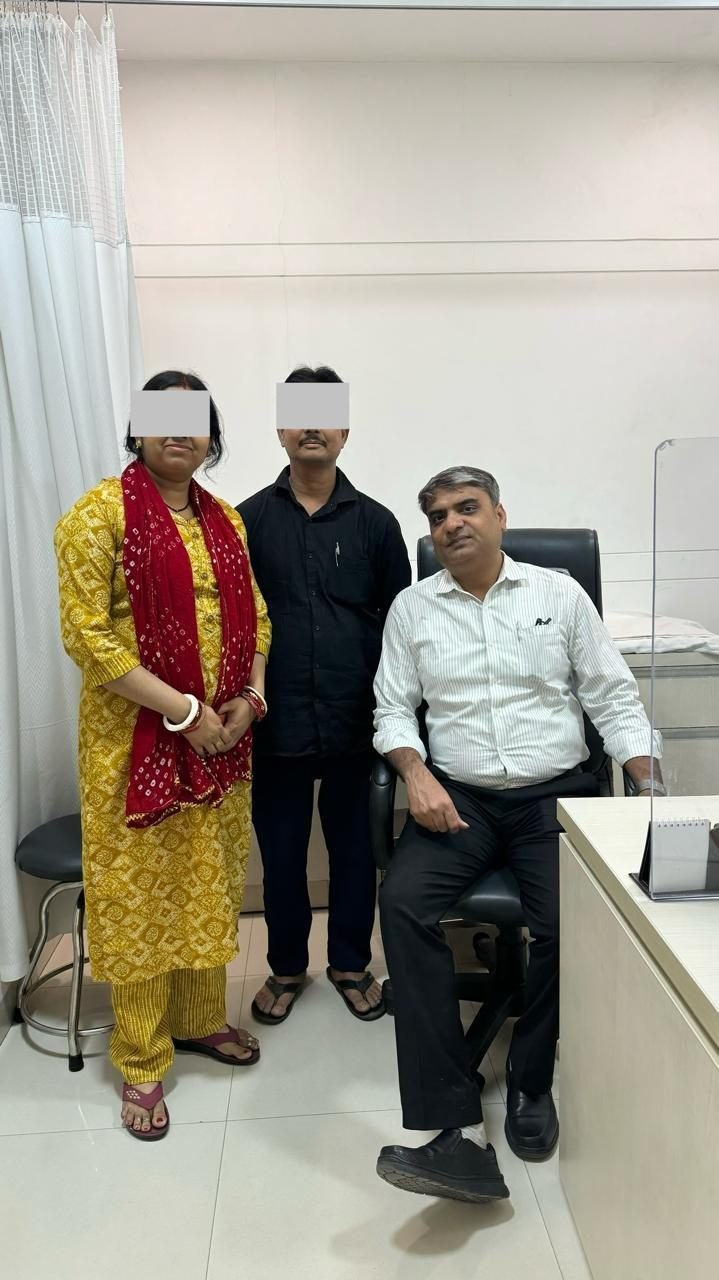 Couple with Dr Manoj Gupta in the consultation room