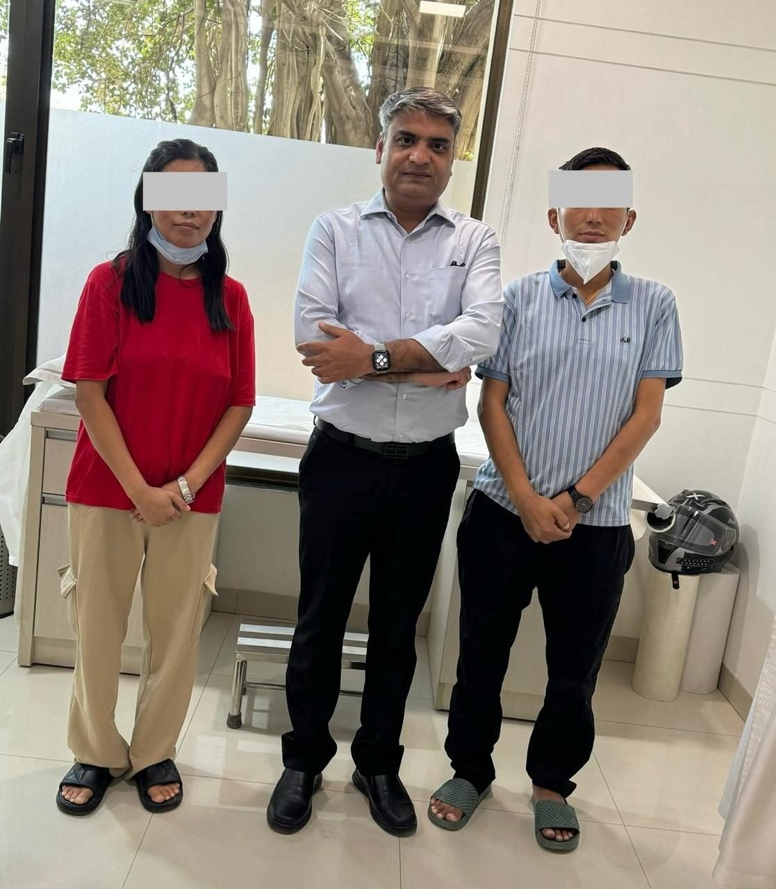 Two patients with Dr Manoj Gupta at follow-up